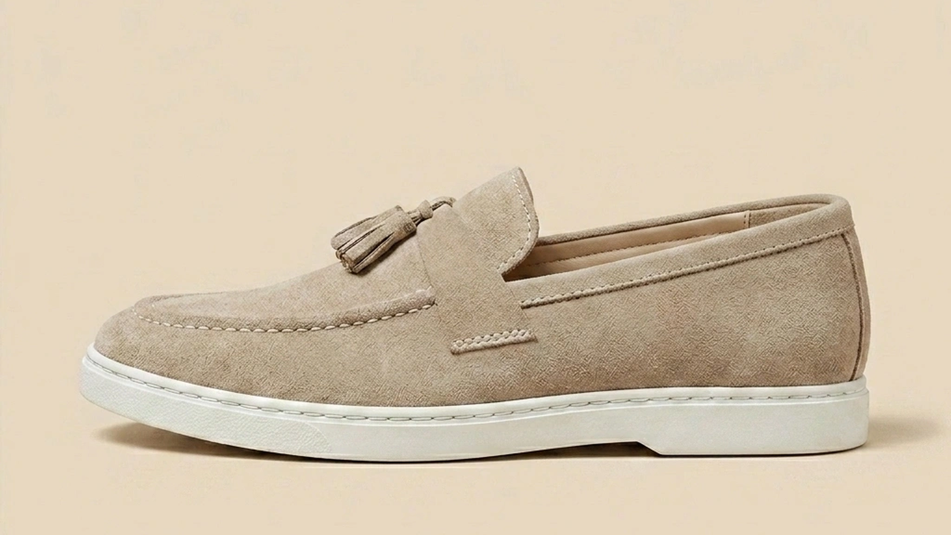 Crisp vulcanised white cup sole on the suede loafer